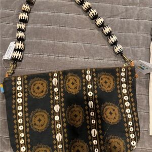 ubuntu life jumbo convertible pouch chocolate with bone bead strap.